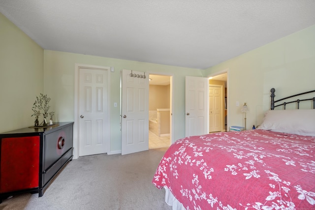 bedroom with carpet and connected bathroom