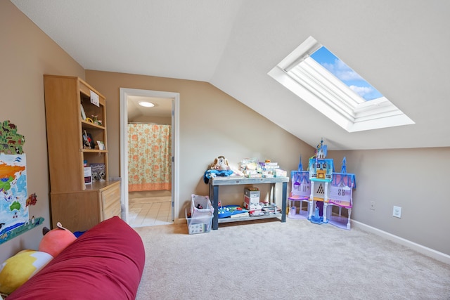 playroom with carpet flooring, baseboards, and lofted ceiling with skylight