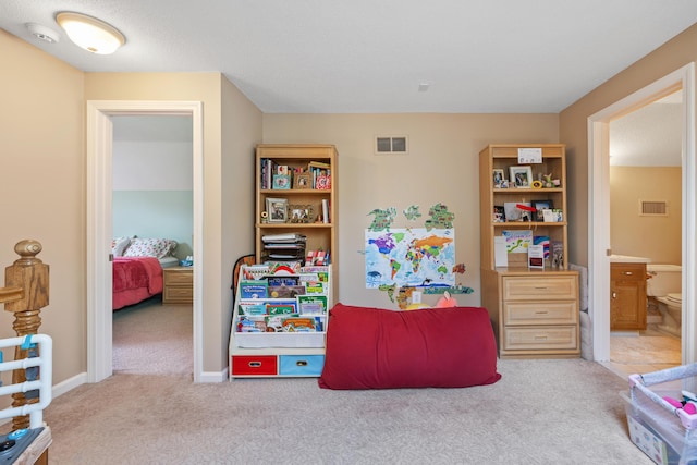 recreation room featuring carpet and visible vents