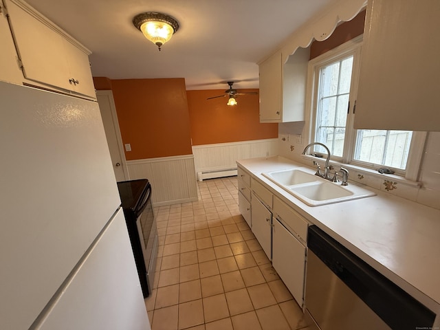 kitchen featuring light countertops, range with electric cooktop, stainless steel dishwasher, and a sink