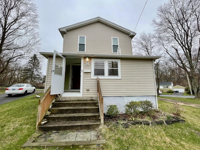 1895 Reservoir Ave, Bridgeport, CT 06606 - traditional-style home featuring entry steps and a front lawn