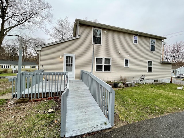 1895 Reservoir Ave, Bridgeport, CT 06606 - rear view of house with a deck and a lawn