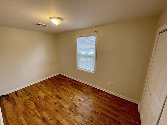 1895 Reservoir Ave, Bridgeport, CT 06606 - unfurnished room featuring visible vents, baseboards, and wood finished floors
