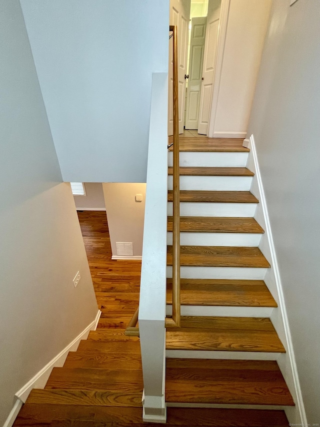 1895 Reservoir Ave, Bridgeport, CT 06606 - staircase with baseboards and wood finished floors