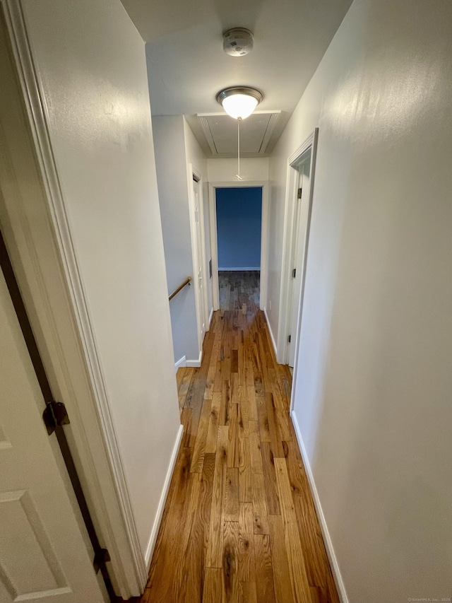 1895 Reservoir Ave, Bridgeport, CT 06606 - hall with baseboards, attic access, and wood finished floors