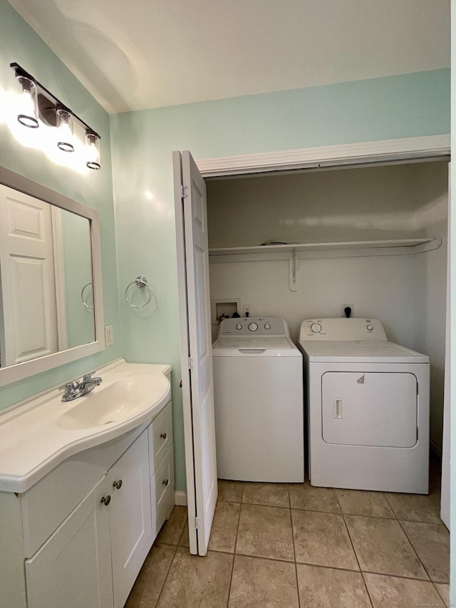 1895 Reservoir Ave, Bridgeport, CT 06606 - bathroom featuring independent washer and dryer, tile patterned floors, and vanity