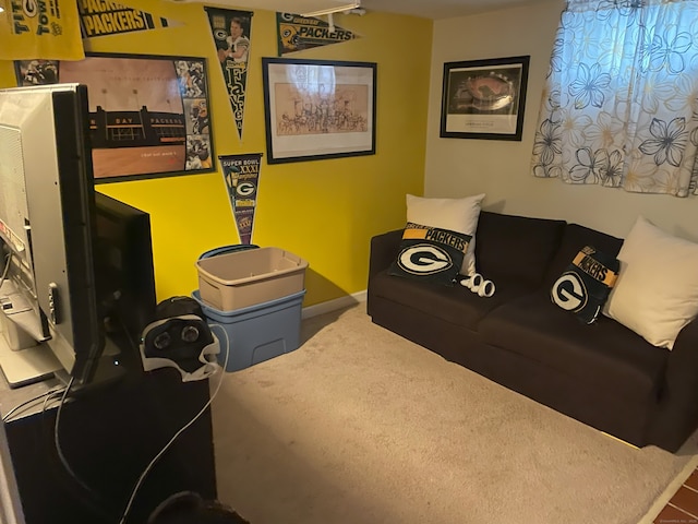 carpeted living room with baseboards
