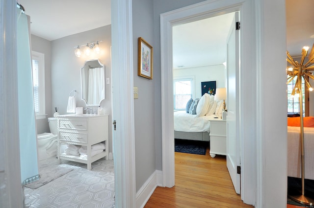 1186 Farmington Ave, West Hartford, CT 06107 - hallway with a sink and light wood finished floors