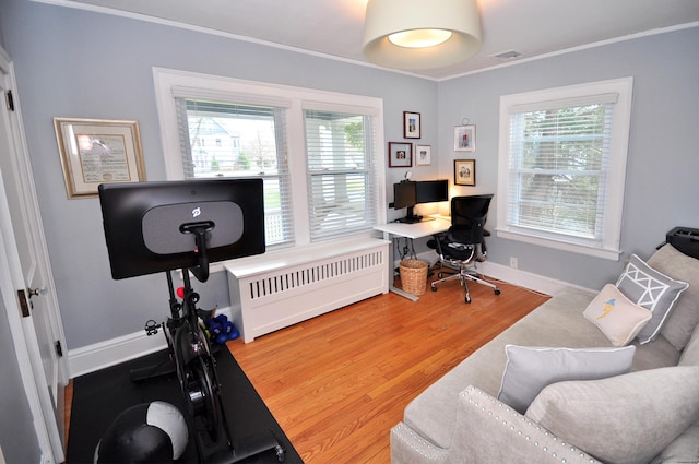 1186 Farmington Ave, West Hartford, CT 06107 - home office with baseboards, ornamental molding, radiator heating unit, and wood finished floors