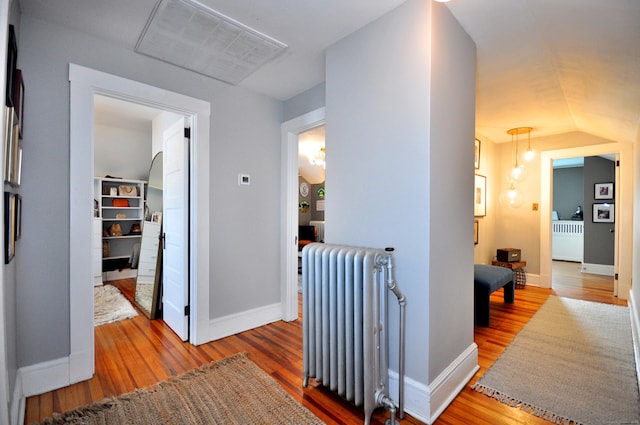 1186 Farmington Ave, West Hartford, CT 06107 - hall featuring radiator, wood finished floors, and baseboards