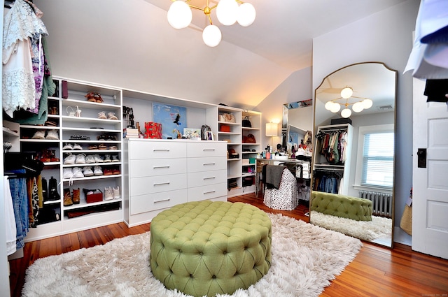 1186 Farmington Ave, West Hartford, CT 06107 - spacious closet featuring a chandelier, wood finished floors, and vaulted ceiling