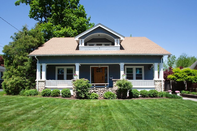 1186 Farmington Ave, West Hartford, CT 06107 - view of front of home featuring a front lawn, roof with shingles, a porch, and stone siding