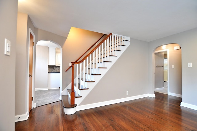 27 Brook St, New Britain, CT 06051 - stairway with arched walkways and wood finished floors