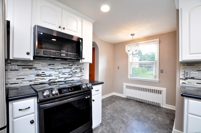 27 Brook St, New Britain, CT 06051 - kitchen featuring stainless steel microwave, stove, radiator, dark countertops, and recessed lighting