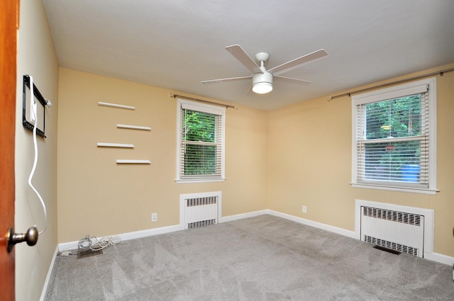 27 Brook St, New Britain, CT 06051 - unfurnished room with radiator, ceiling fan, carpet flooring, and plenty of natural light