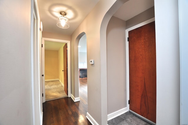 27 Brook St, New Britain, CT 06051 - corridor with arched walkways and dark wood finished floors