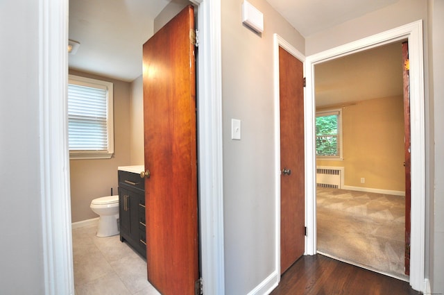 27 Brook St, New Britain, CT 06051 - corridor featuring radiator heating unit and baseboards