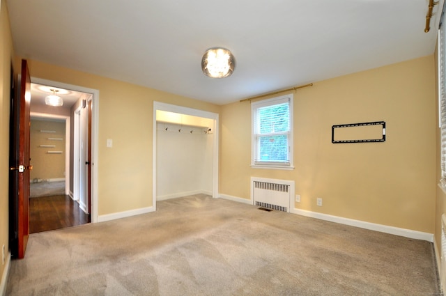 27 Brook St, New Britain, CT 06051 - unfurnished bedroom featuring radiator heating unit, carpet, and a closet