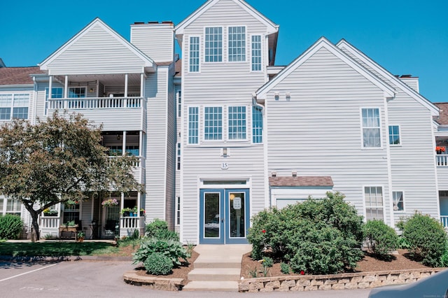 15 Forest Glen Cir Unit 19, Middletown, CT 06419 - back of house with french doors and a chimney