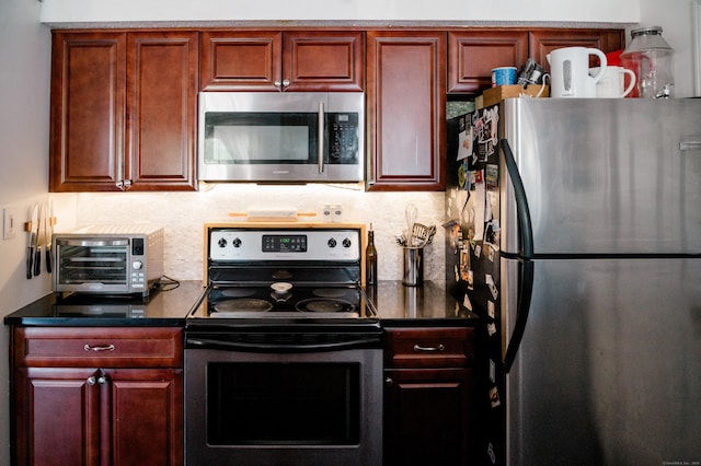 15 Forest Glen Cir Unit 19, Middletown, CT 06419 - kitchen featuring appliances with stainless steel finishes, backsplash, dark countertops, and dark brown cabinets