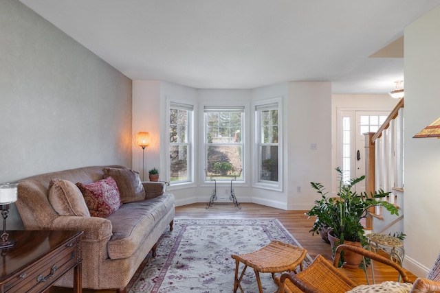 living room featuring wood finished floors and baseboards