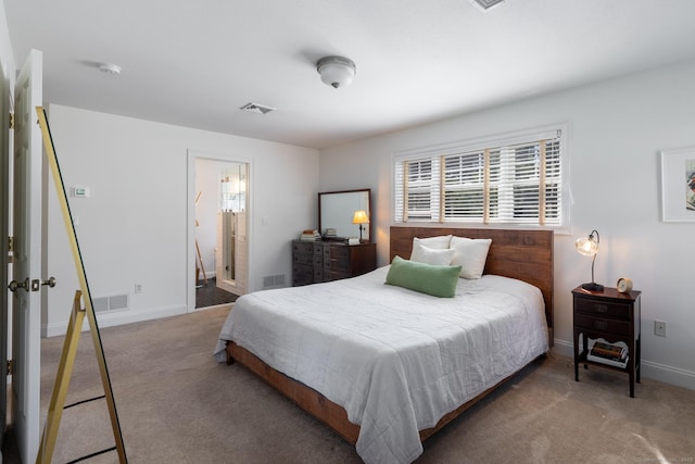 carpeted bedroom with baseboards and visible vents