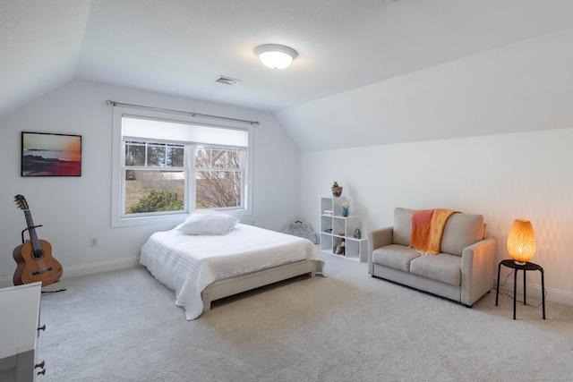 bedroom featuring vaulted ceiling, carpet flooring, and baseboards