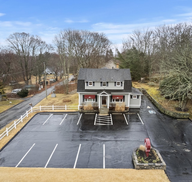 197 Norwich New London Tpke, Montville, CT 06382 - exterior space featuring a chimney, fence, uncovered parking, and roof with shingles