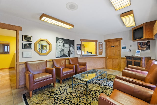 197 Norwich New London Tpke, Montville, CT 06382 - tiled living room featuring a wainscoted wall