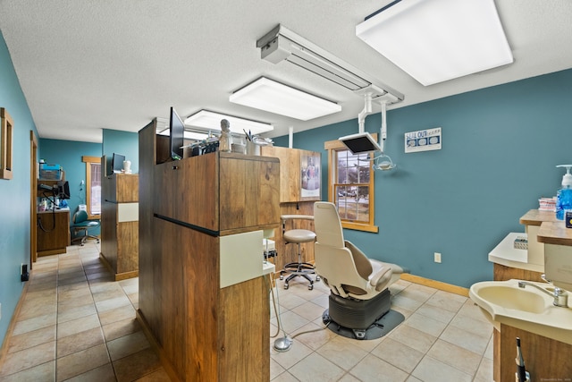 197 Norwich New London Tpke, Montville, CT 06382 - interior space with tile patterned floors, a sink, baseboards, and a textured ceiling