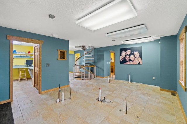 197 Norwich New London Tpke, Montville, CT 06382 - unfurnished room with visible vents, baseboards, stairway, and a textured ceiling