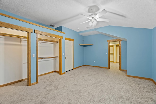 197 Norwich New London Tpke, Montville, CT 06382 - unfurnished bedroom with a textured ceiling, visible vents, carpet floors, multiple closets, and baseboards