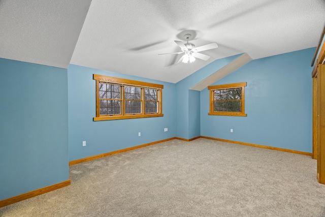 197 Norwich New London Tpke, Montville, CT 06382 - additional living space with baseboards, vaulted ceiling, a textured ceiling, a ceiling fan, and carpet