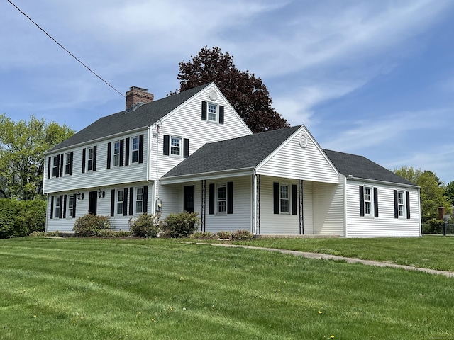 464 Highland St, Wethersfield, CT 06109 - colonial inspired home featuring a chimney, a front yard, a porch, and roof with shingles
