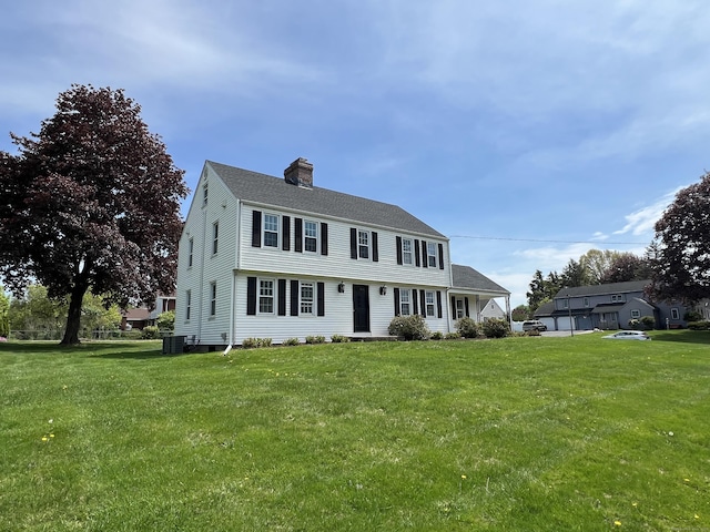 464 Highland St, Wethersfield, CT 06109 - colonial-style house featuring central air condition unit, a chimney, a front yard, and roof with shingles