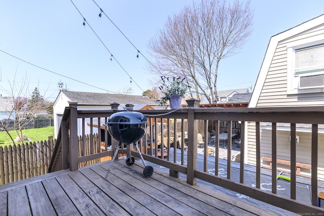 deck with grilling area and fence