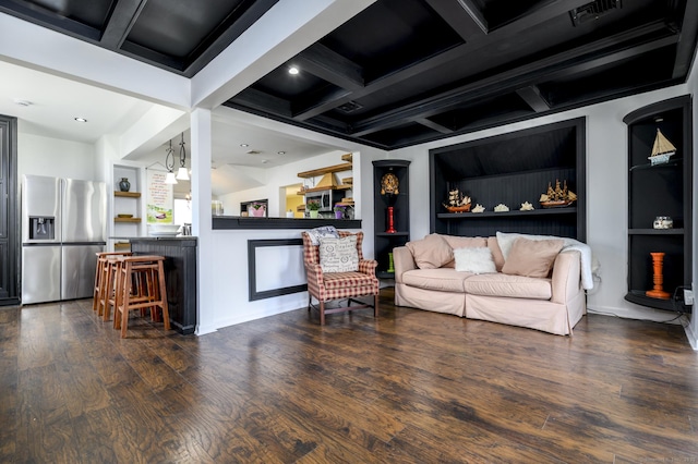 living room with wood finished floors, visible vents, and coffered ceiling