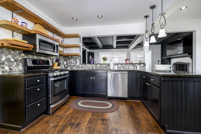 kitchen with dark wood-style floors, dark stone countertops, open shelves, appliances with stainless steel finishes, and dark cabinets