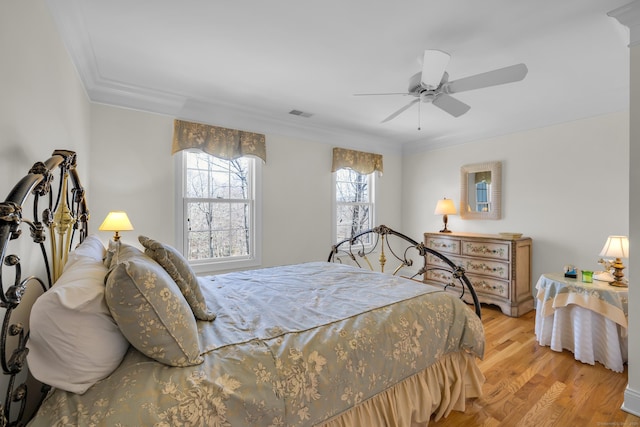 710 Alexander Dr, Guilford, CT 06437 - bedroom featuring ceiling fan, ornamental molding, visible vents, and light wood finished floors
