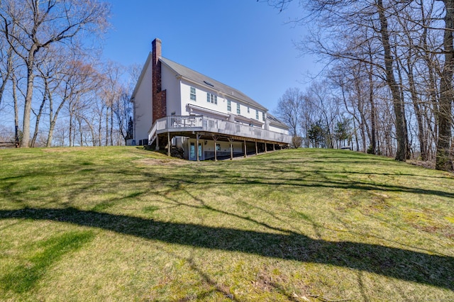 710 Alexander Dr, Guilford, CT 06437 - back of house with a yard, a chimney, and a deck