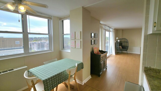 interior space with baseboards and wood finished floors