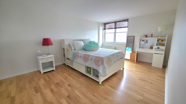 bedroom with light wood-style flooring