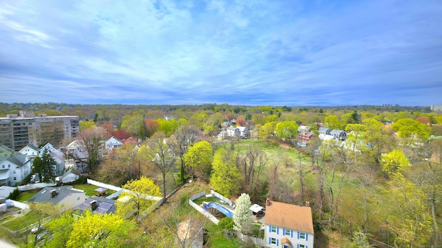 drone / aerial view featuring a view of trees
