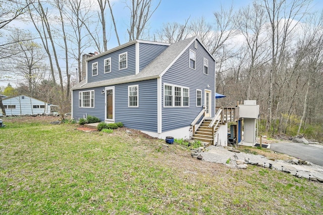 378 Rte 87, Columbia, CT 06237 - view of front of home featuring roof with shingles, stairs, a deck, a front lawn, and a chimney