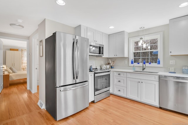378 Rte 87, Columbia, CT 06237 - kitchen with a sink, stainless steel appliances, recessed lighting, light wood finished floors, and light countertops