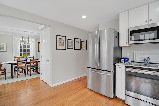 378 Rte 87, Columbia, CT 06237 - kitchen with an inviting chandelier, light wood-style floors, stainless steel appliances, and baseboards