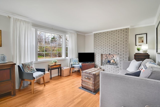 378 Rte 87, Columbia, CT 06237 - living area with light wood finished floors, a fireplace, and crown molding