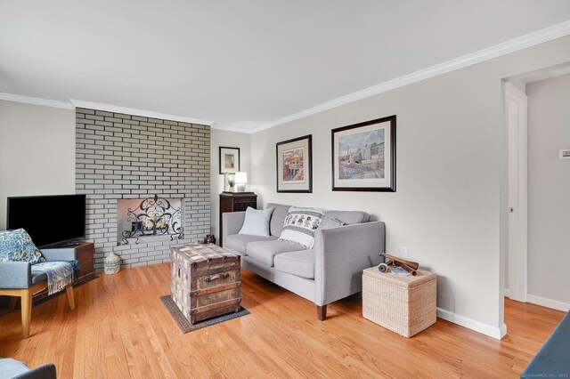 378 Rte 87, Columbia, CT 06237 - living room featuring crown molding, light wood-type flooring, baseboards, and a fireplace