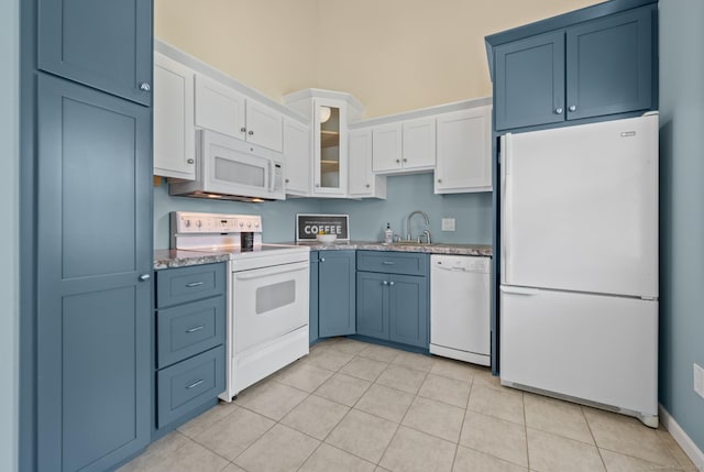 1 Abbott Rd Unit 32, Ellington, CT 06029 - kitchen with white appliances, a sink, white cabinetry, glass insert cabinets, and light tile patterned floors