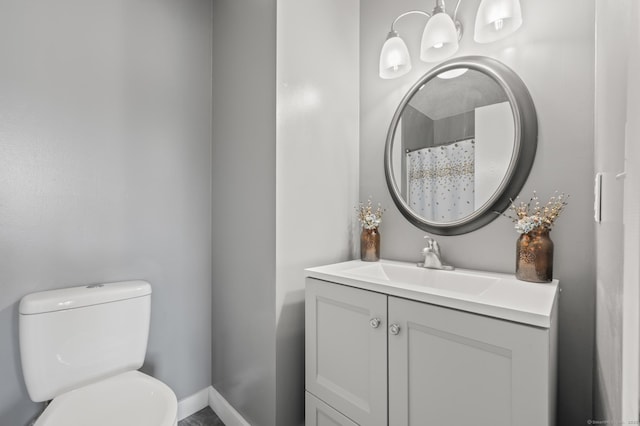 1 Abbott Rd Unit 32, Ellington, CT 06029 - bathroom with toilet, vanity, and baseboards